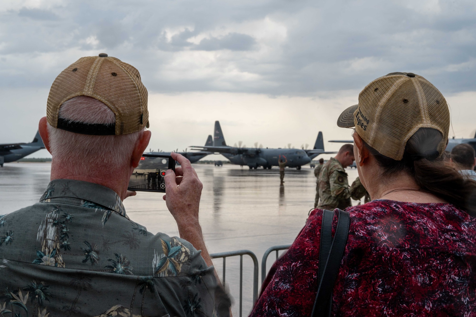 Family and friends await the return of deployed Airmen from the 317th Airlift Wing at Dyess Air Force Base, Texas, Sept. 5, 2025.The airlift wing has operated on a staggered schedule, deploying one of its two airlift squadrons at a time for the past year.  (U.S. Air Force photo by Airman William Neal)