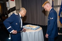 U.S. Air Force Brig. Gen. Jason Lennen, director of policy and resources at the Office of the Surgeon General, cuts the Air Force birthday cake with Airman 1st Class Tobiyah Nash, a ceremonial guardsman with the U.S. Air Force Honor Guard Memorial Colors, during the Joint Base Anacostia-Bolling U.S. Air Force 78th Birthday Ball, Washington, D.C., Sept. 5, 2025. It is traditional for the most senior and most junior Airmen in attendance to cut the cake, symbolizing the passing of legacy from one generation to the next. (U.S. Air Force photo by Hayden Hallman)