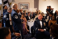 U.S. Air Force Col. James A. Hudnell, deputy commander of Joint Base Anacostia-Bolling and the 11th Wing, center right, listens to The U.S. Air Force Band’s Strolling Strings during the JBAB U.S. Air Force 78th Birthday Ball, Washington, D.C., Sept. 5, 2025. The Strolling Strings provided a modern touch on classical entertainment, inspiring listeners and honoring Air Force heritage. (U.S. Air Force photo by Hayden Hallman)
