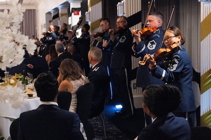 The U.S. Air Force Band’s Strolling Strings perform during the Joint Base Anacostia-Bolling U.S. Air Force 78th Birthday Ball, Washington, D.C., Sept. 5, 2025. The Strolling Strings provided a modern touch on classical entertainment, inspiring listeners and honoring Air Force heritage.  (U.S. Air Force photo by Hayden Hallman)