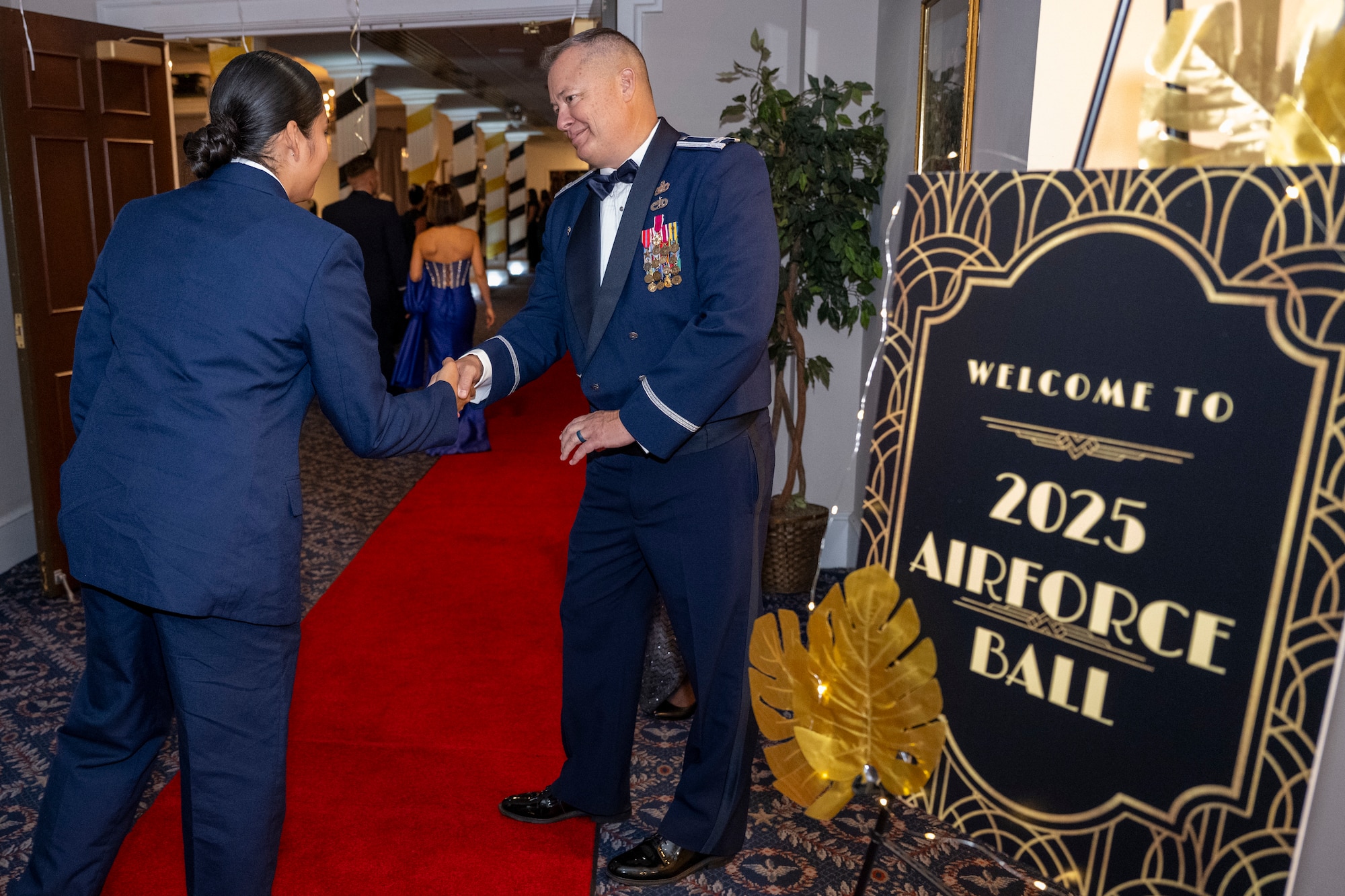 U.S. Air Force Col. James M. Clark, commander of Joint Base Anacostia-Bolling and the 11th Wing, right, shakes hands with an attendee of the JBAB U.S. Air Force 78th Birthday Ball, Washington, D.C., Sept. 5, 2025. The U.S. Air Force Honor Guard delivered premier ceremonial honors and The United States Air Force Band’s Strolling Strings honored Air Force heritage in support of the event. (U.S. Air Force photo by Hayden Hallman)