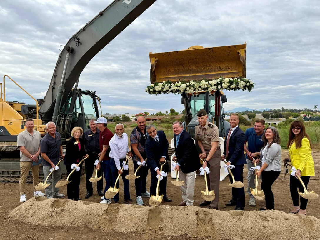 Shovels in hand, distinguished guests of the Murrieta Creek Flood Control, Environmental Restoration and Recreation Project Phase 2B groundbreaking ceremony gather for photos Aug. 28 in Temecula, California.