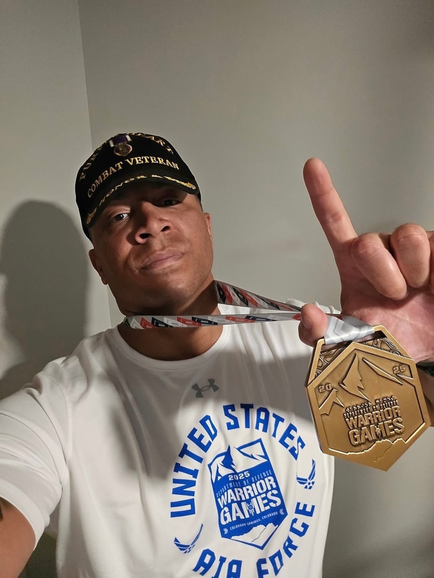 U.S. Air Force Master Sgt. Ryan Hines, a Purple Heart recipient and Air Force Wounded Warrior Ambassador and Mentor from Tampa, Florida, assigned to the 6th Logistics Readiness Squadron at MacDill Air Force Base, Florida, displays his gold medal won for Team Air Force in indoor rowing July 21, 2025, in Colorado Springs, Colorado. The 2025 Warrior Games, held July 18-26 under the “Limitless” theme, united nearly 200 wounded, ill and injured service members and veterans from all U.S. military branches, competing for 800 medals across 11 adaptive sports. (Courtesy photo by Master Sgt. Ryan Hines)