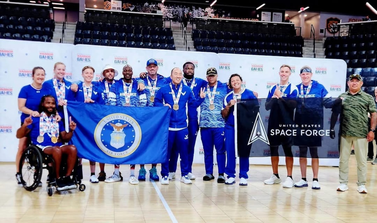 U.S. Air Force Team Air Force athletes pose for a group photo after winning the gold medal in the indoor rowing event for Team Air Force at the 2025 DoD Warrior Games in Colorado Springs, Colorado, July 21, 2025. The DoD Warrior Games, hosted by the U.S. Army Training and Doctrine Command from July 18-26, 2025, unite nearly 200 wounded, ill and injured service members and veterans in 11 adaptive sports to enhance recovery through community and competition. A paralympic-style event initiated by the U.S. Olympic Committee from 2010 to 2014 in Colorado Springs, the games have been DoD-hosted since 2015, starting with the U.S. Marine Corps at Quantico, Virginia. (U.S. Air Force photo by Air Force Wounded Warrior Program)