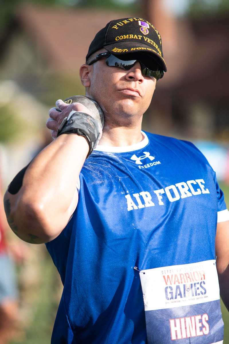 U.S. Air Force Master Sgt. Ryan Hines, a Purple Heart recipient and Air Force Wounded Warrior (AFW2) Ambassador from Tampa, Fla., and section chief for Fuels Operations with the 6th Logistics Readiness Squadron at MacDill Air Force Base, Fla., prepares to throw a shot put during a field competition at the 2025 Department of Defense Warrior Games in Colorado Springs, Colorado, July 22, 2025. The DoD Warrior Games is an adaptive sports competition that celebrates the dedication of military service members resiliency in recovering from being wounded, injured or ill through a series of competitive sports that demonstrates the remarkable potential of our service members. 
(Courtesy photo by Joe Rogers)