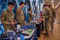 Airmen visit a National Preparedness Month booth at Joint Base Anacostia-Bolling, Washington, D.C., Sept. 9, 2025.
