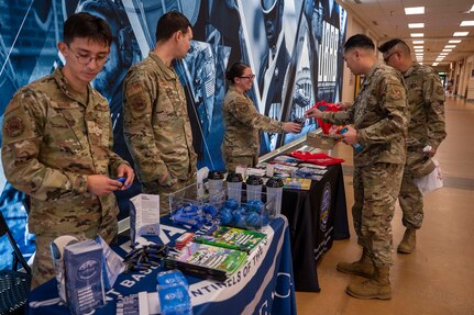 Airmen visit a National Preparedness Month booth at Joint Base Anacostia-Bolling, Washington, D.C., Sept. 9, 2025.