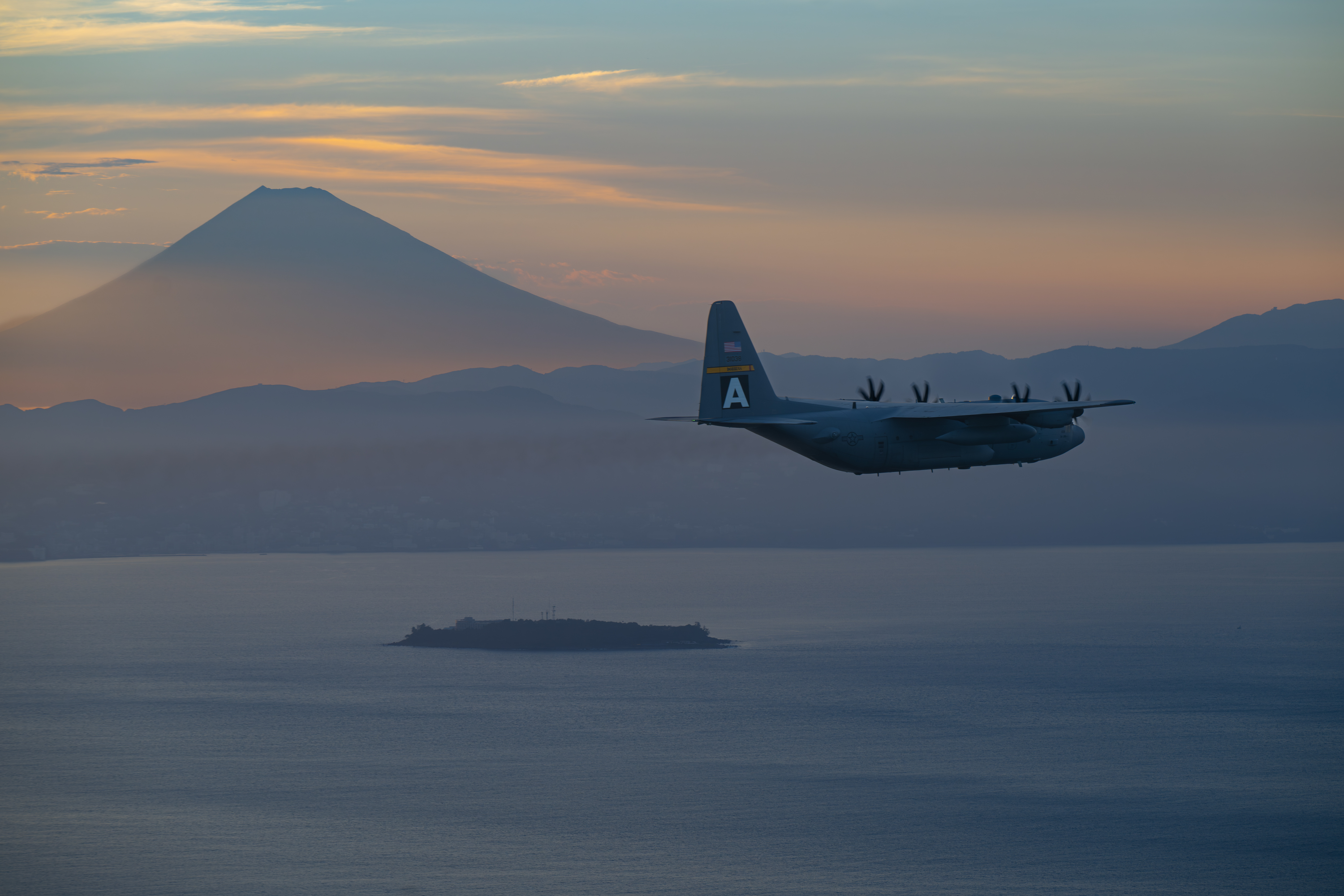 airplane flying with mount fuji in background
