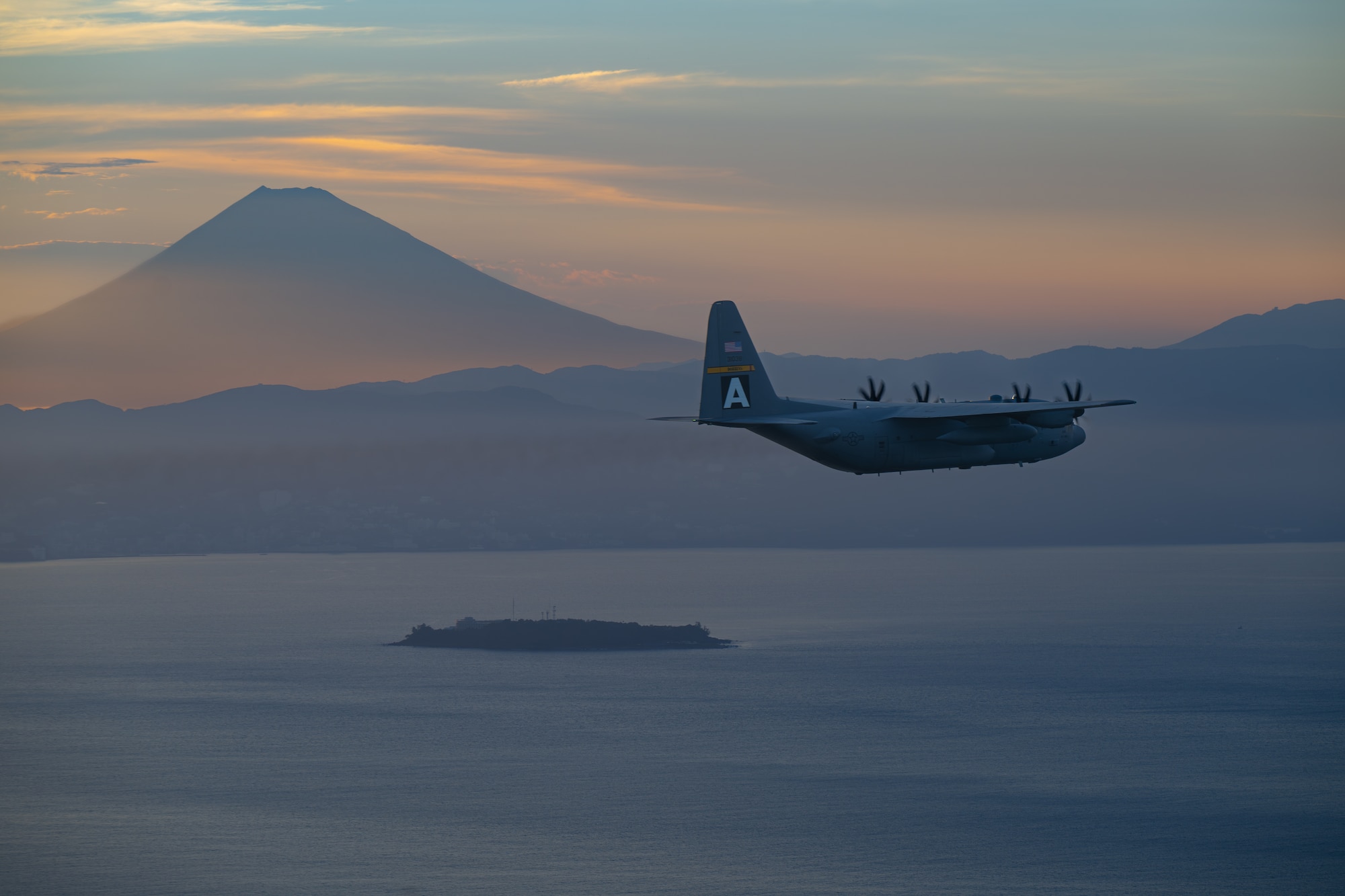 airplane flying with mount fuji in background