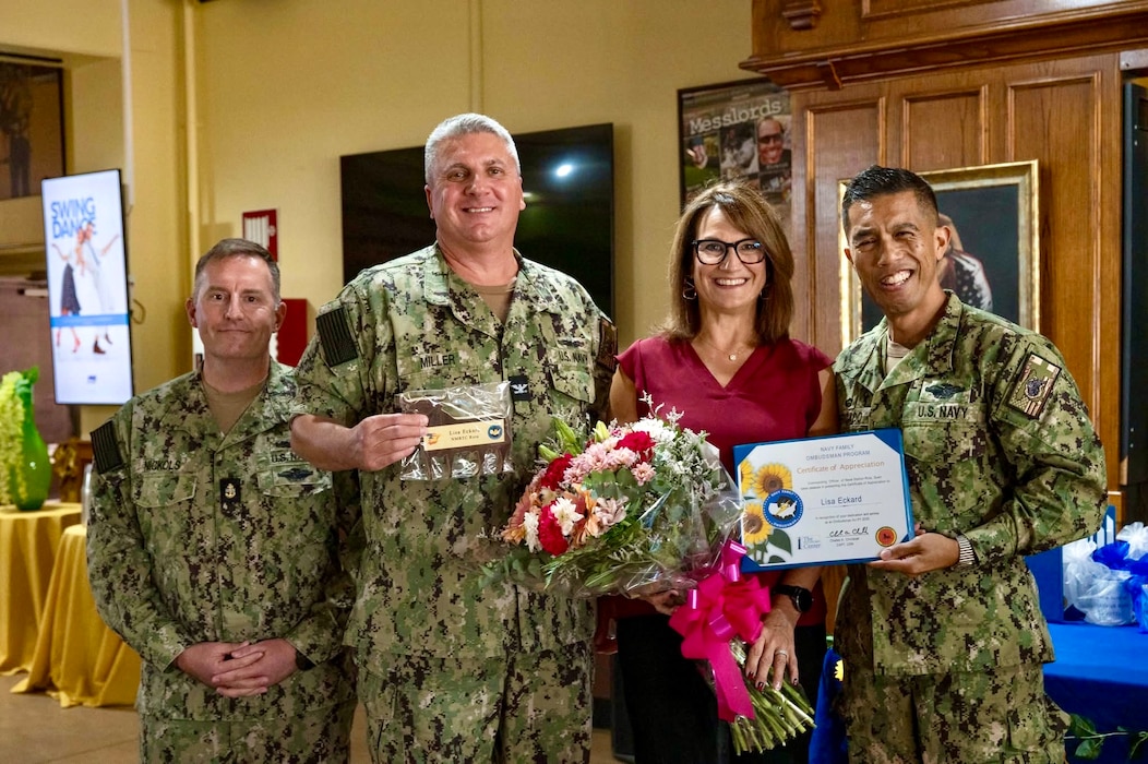 250905-N-FT324-8034. ROTA, Spain (September 5, 2025). Naval Medical Readiness and Training Command (NMRTC) Rota Ombudsman, Ms. Lisa Eckard (right) was presented with a token of gratitude for her dedicated service, in honor of Ombudsman Appreciation Month, by NMRTC Rota Commanding Officer, Capt. Michael Mercado, September 5, 2025. Ombudsmen serve as vital links between commands and families, providing communication, support, and guidance to ensure Sailors’ loved ones are cared for. (U.S. Navy photo by Mass Communication Specialist 1st Class Drace Wilson)