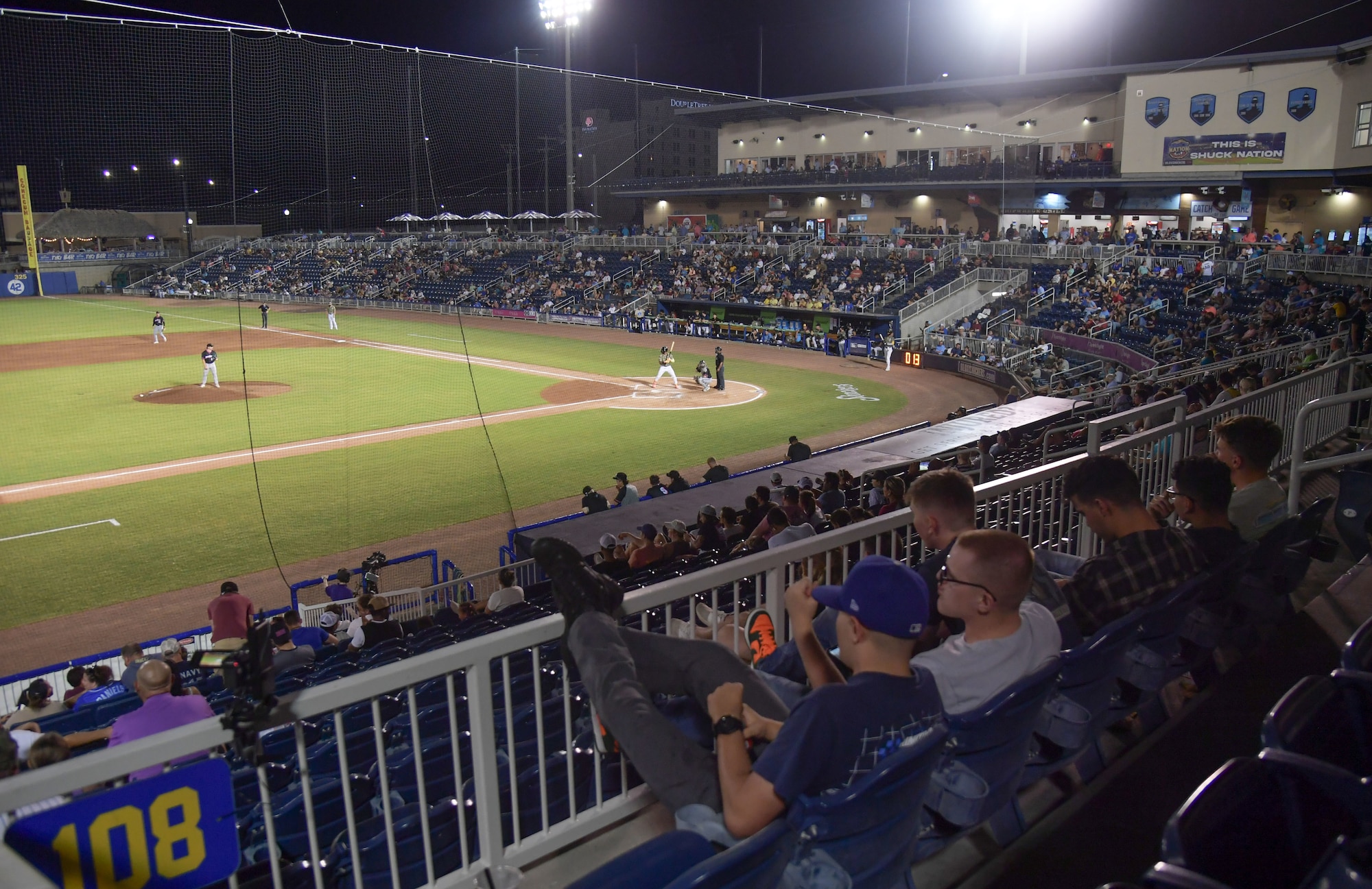 A baseball stadium is filled with guests