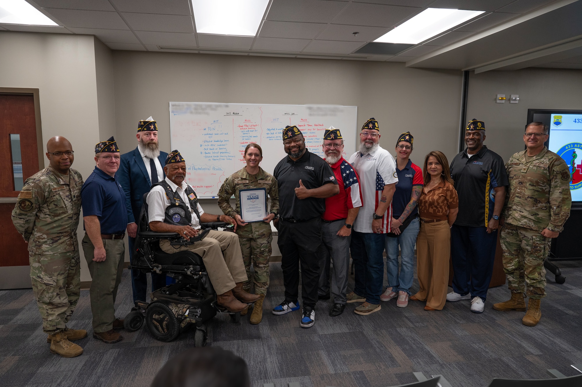 Representatives from various American Legion posts throughout Bexar County came to witness the Spirit of Service Award presentation to Staff Sgt. Lindsey Neubauer, 433rd Aeromedical Staging Squadron, during the 433rd Medical Group’s commander’s call, Aug. 2, 2025.