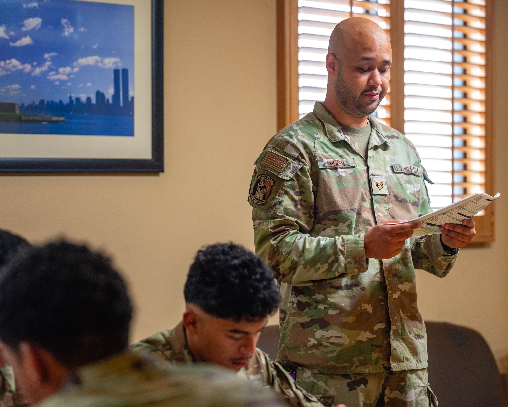 U.S. Air Force Tech. Sgt. John Cooper, 56th Civil Engineer Squadron unaccompanied housing non-commissioned officer in charge, briefs a group of Airmen, Sept. 2, 2025, at Luke Air Force Base, Arizona.