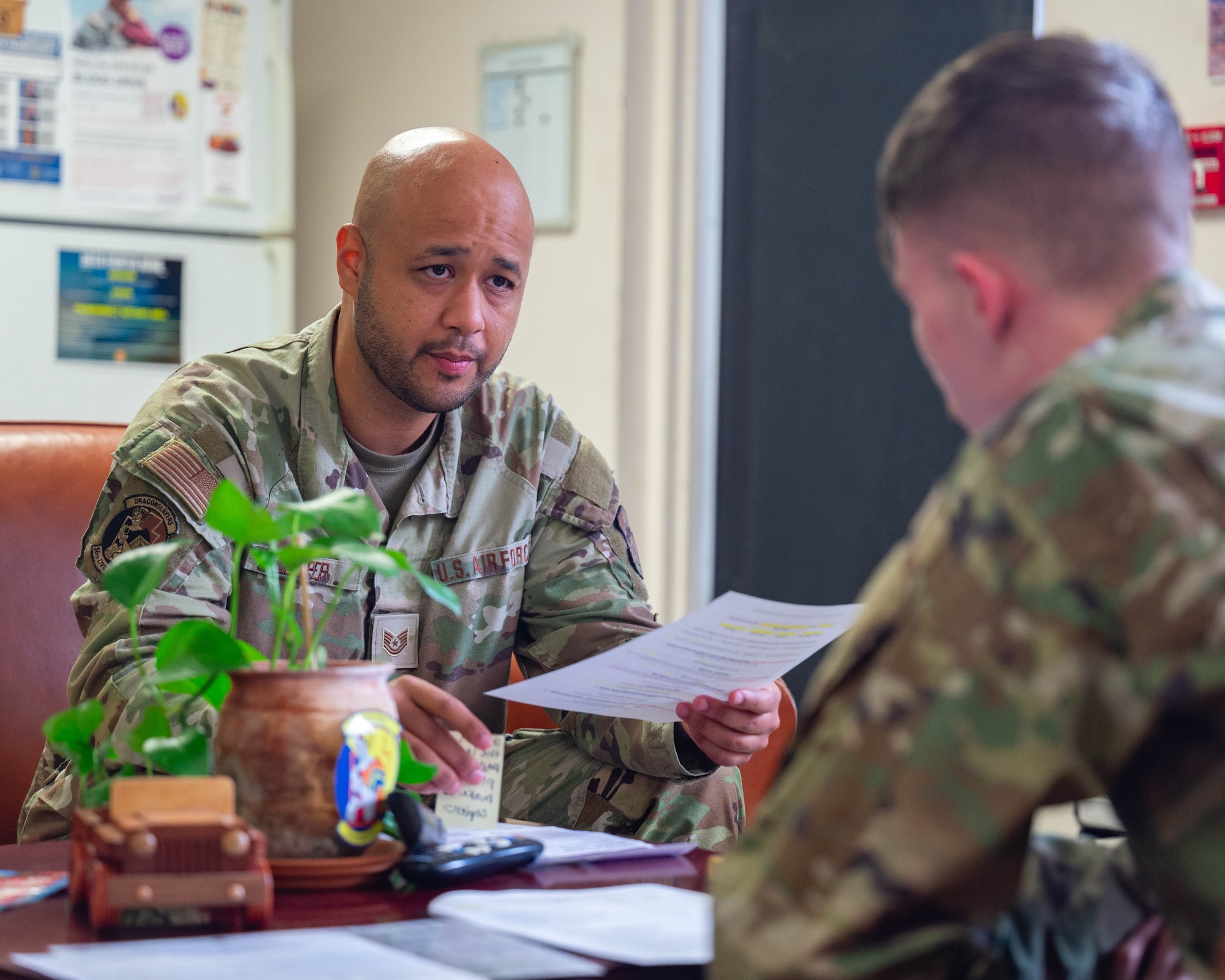 U.S. Air Force Tech. Sgt. John Cooper, 56th Civil Engineer Squadron unaccompanied housing non-commissioned officer in charge, briefs an Airman on dorm etiquette, Sept. 3, 2025, at Luke Air Force Base, Arizona.