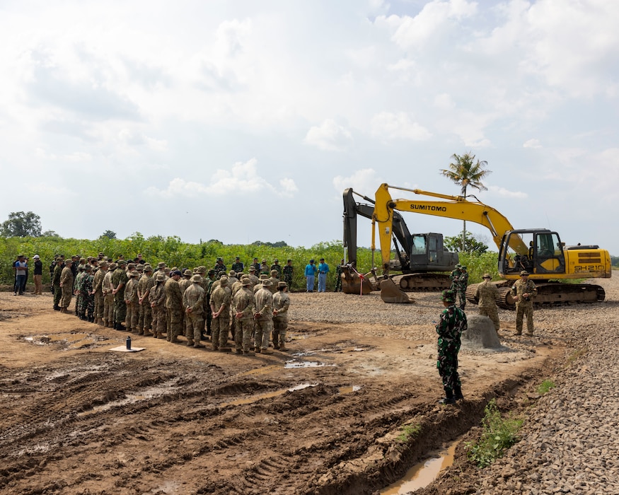 U.S. Army engineers assigned to the 523rd Engineer Support Company, 84th Engineer Battalion, 130th Engineer Brigade, engineers from the Canadian Armed Forces, and engineers from the Indonesian National Armed Forces, attend a ribbon cutting ceremony for a new road constructed during exercise Super Garuda Shield 25 in Baturaja, Indonesia, Sept. 2, 2025.