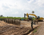 U.S. Army engineers assigned to the 523rd Engineer Support Company, 84th Engineer Battalion, 130th Engineer Brigade, engineers from the Canadian Armed Forces, and engineers from the Indonesian National Armed Forces, attend a ribbon cutting ceremony for a new road constructed during exercise Super Garuda Shield 25 in Baturaja, Indonesia, Sept. 2, 2025.