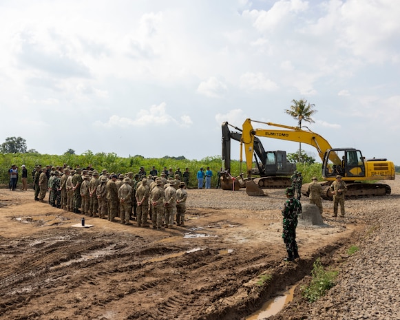 U.S. Army engineers assigned to the 523rd Engineer Support Company, 84th Engineer Battalion, 130th Engineer Brigade, engineers from the Canadian Armed Forces, and engineers from the Indonesian National Armed Forces, attend a ribbon cutting ceremony for a new road constructed during exercise Super Garuda Shield 25 in Baturaja, Indonesia, Sept. 2, 2025.