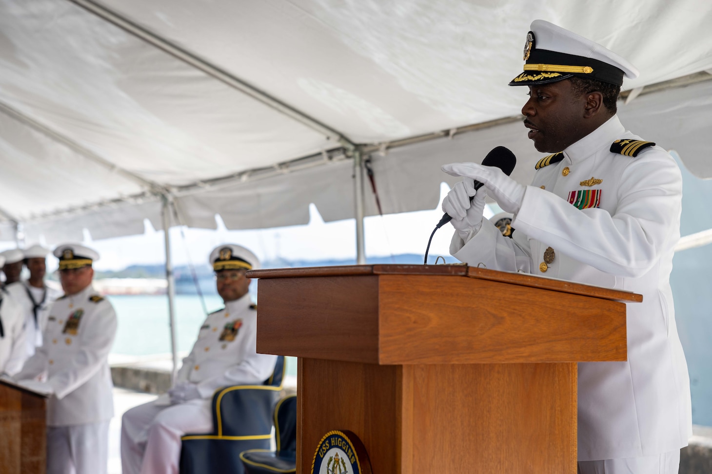 APRA HARBOR, Guam (Aug. 24, 2025) Cmdr. Ronald Jenkins, outgoing commanding officer of the Arleigh Burke-class guided-missile destroyer USS Higgins (DDG 76), gives remarks at the Higgins change of command ceremony onboard Naval Base Guam in Apra Harbor, Guam, Aug. 24. Higgins is forward-deployed and assigned to Destroyer Squadron (DESRON) 15, the Navy’s largest DESRON and the U.S. 7th Fleet’s principal surface force. (U.S. Navy photo by Mass Communication Specialist 2nd Class Trevor Hale)