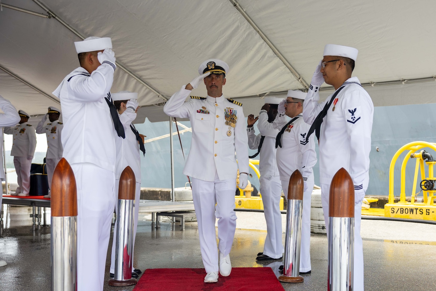 APRA HARBOR, Guam (Aug. 24, 2025) Capt. Dave Huljack, commodore of Destroyer Squadron (DESRON) 15, salutes side boys during the change of command ceremony for the Arleigh Burke-class guided-missile destroyer USS Higgins (DDG 76) onboard Naval Base Guam in Apra Harbor, Guam, Aug. 24. Higgins is forward-deployed and assigned to DESRON 15, the Navy’s largest DESRON and the U.S. 7th Fleet’s principal surface force. (U.S. Navy photo by Mass Communication Specialist 2nd Class Trevor Hale)