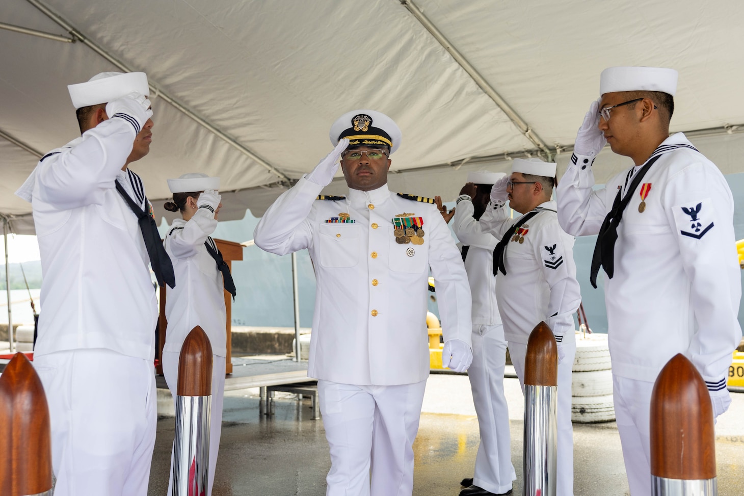 APRA HARBOR, Guam (Aug. 24, 2025) Cmdr. Jordan White, incoming commanding officer of the Arleigh Burke-class guided-missile destroyer USS Higgins (DDG 76), salutes side boys during the Higgins change of command ceremony onboard Naval Base Guam, in Apra Harbor, Guam, Aug. 24. Higgins is forward-deployed and assigned to Destroyer Squadron (DESRON) 15, the Navy’s largest DESRON and the U.S. 7th Fleet’s principal surface force. (U.S. Navy photo by Mass Communication Specialist 2nd Class Trevor Hale)