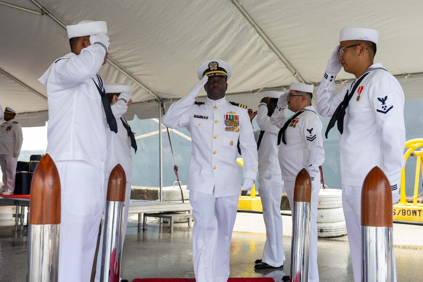 APRA HARBOR, Guam (Aug. 24, 2025) Cmdr. Ronald Jenkins, outgoing commanding officer of the Arleigh Burke-class guided-missile destroyer USS Higgins (DDG 76), salutes side boys during the Higgins change of command ceremony onboard Naval Base Guam, in Apra Harbor, Guam, Aug. 24. Higgins is forward-deployed and assigned to Destroyer Squadron (DESRON) 15, the Navy’s largest DESRON and the U.S. 7th Fleet’s principal surface force. (U.S. Navy photo by Mass Communication Specialist 2nd Class Trevor Hale)