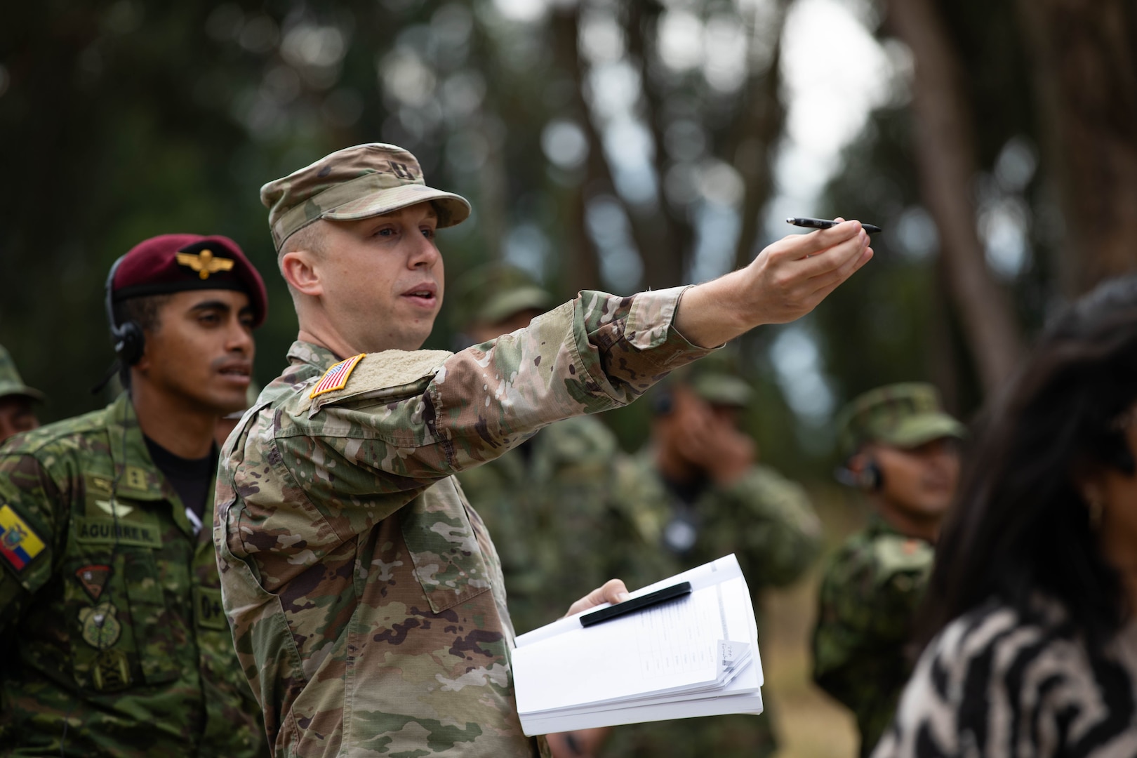 U.S. Army Capt. Mitchell Hagen teaches Ecuadorian servicemembers of the 9th Special Forces Brigade how to approximate the height of trees as part of a class on landing zone designation in Latacunga, Ecuador, Aug. 21, 2025.