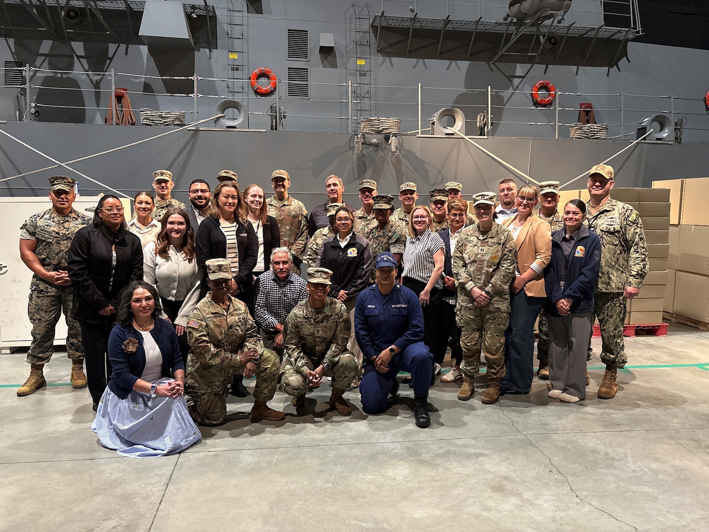 The USMEPCOM military member and civilian employee of the year finalists pose for a photo during the Naval Station Great Lakes battle station.