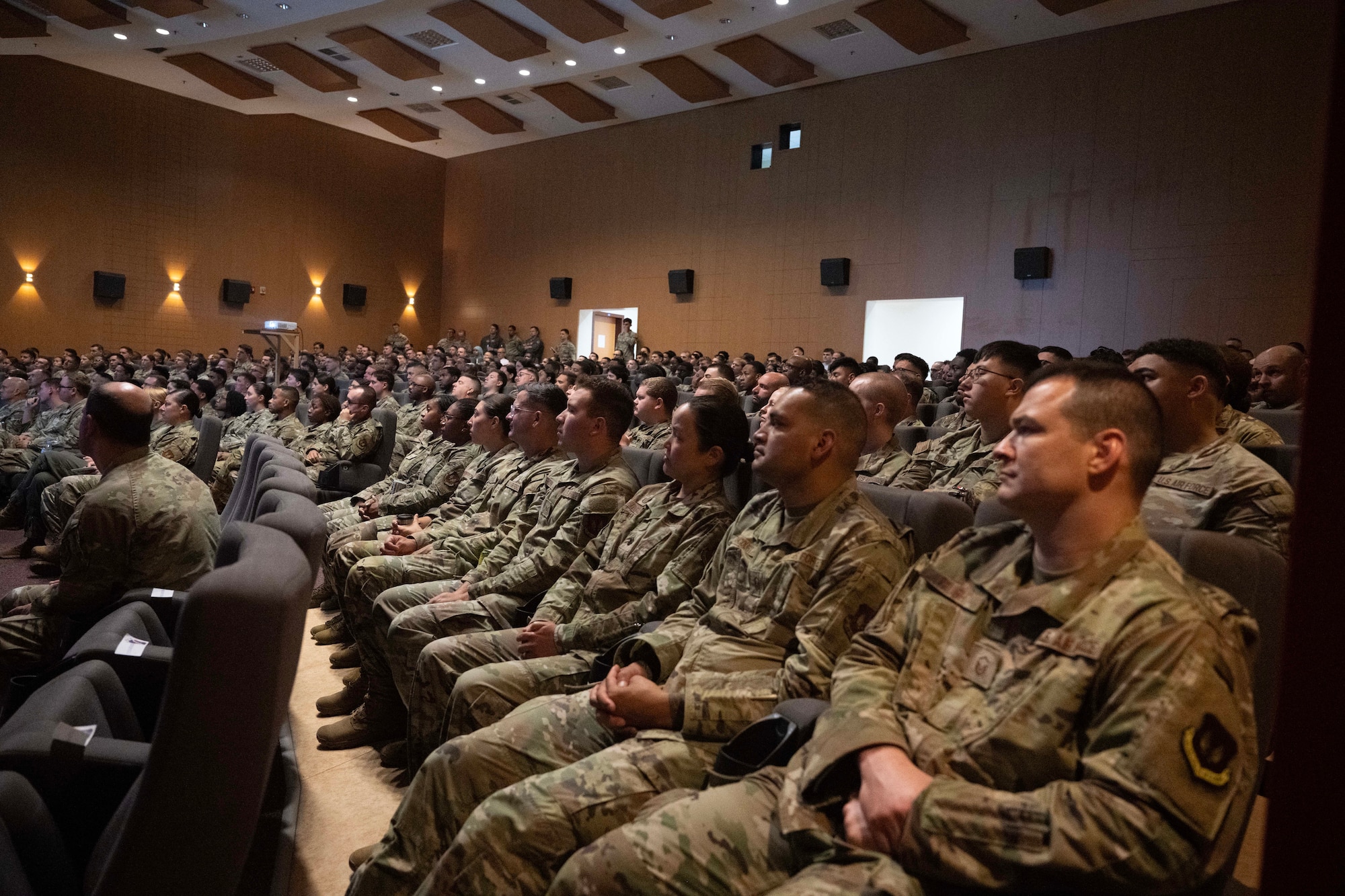 Airmen assigned to the 39th Air Base Wing listen to an all-call briefing at Incirlik Air Base, Türkiye, Sept. 4, 2025. The event marked the launch of preparations for exercise Titan Shield 25-09, aligning personnel on mission expectations, safety protocols, and operational objectives to ensure readiness for decisive response during the upcoming exercise. (U.S. Air Force photo by Senior Airman Greydon Furstenau)