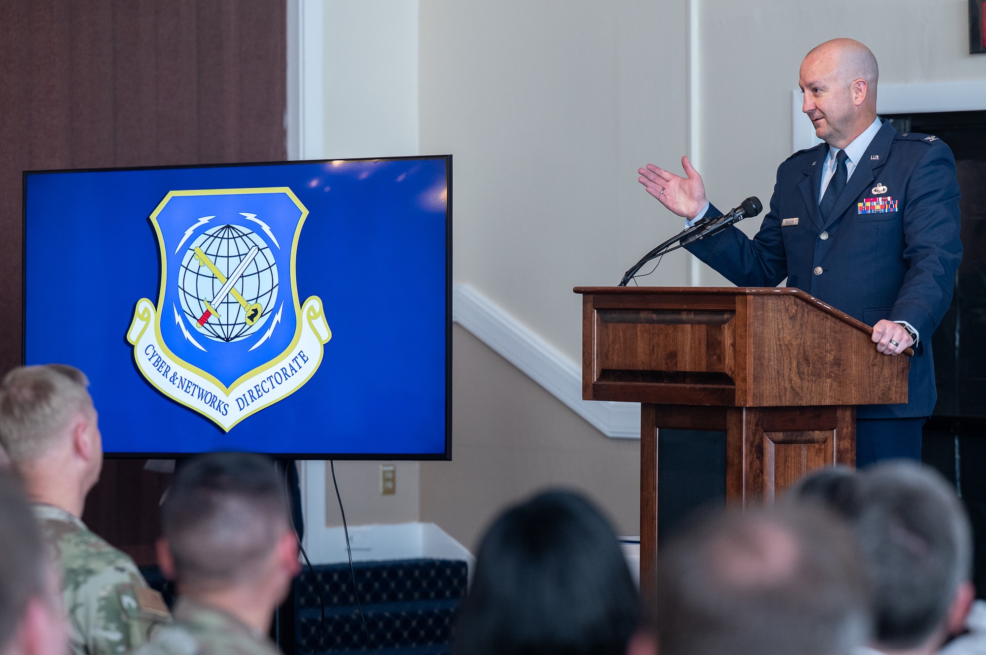 Image of Airman speaking to crowd.