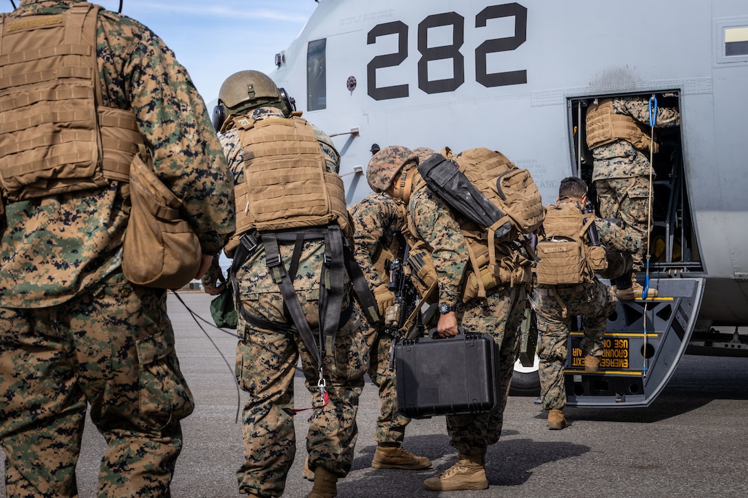 U.S. Marines with 2nd Battalion, 14th Marine regiment, 4th Marine Division, load onto a C-130 during after High Mobility Artillery Rocket System (HIMARS) training during ARCTIC EDGE 2025 (AE25), at Cold Bay, Alaska, Aug. 17th, 2025. Specialized Arctic training generates valuable lessons learned for warfighters and enablers ensuring they can execute their assigned missions in any environment. AE25 is a NORAD and U.S. Northern Command-led homeland defense exercise designed to improve readiness, demonstrate capabilities and enhance Joint and Allied Force interoperability in the Arctic. (U.S. Marine Corps Photo by Lance Cpl. Edward Spears)