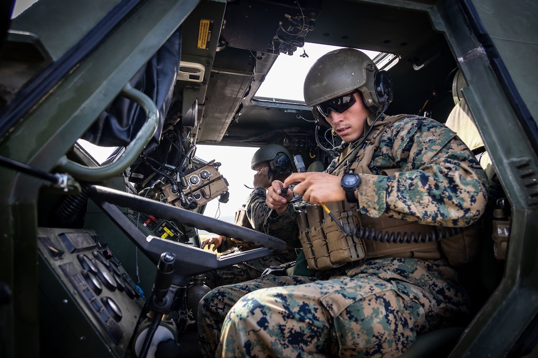 U.S. Marine Corps Lance Cpl. Tristan Coriz, a High Mobility Artillery Rocket System (HIMARS) operator, with 2nd Battalion, 14th Marine regiment, 4th Marine Division, connects a HIMARS launching system during ARCTIC EDGE 2025 (AE25), at Cold Bay, Alaska, Aug. 17th, 2025. Specialized Arctic training generates valuable lessons learned for warfighters and enablers ensuring they can execute their assigned missions in any environment. AE25 is a NORAD and U.S. Northern Command-led homeland defense exercise designed to improve readiness, demonstrate capabilities and enhance Joint and Allied Force interoperability in the Arctic. (U.S. Marine Corps Photo by Lance Cpl. Edward Spears)