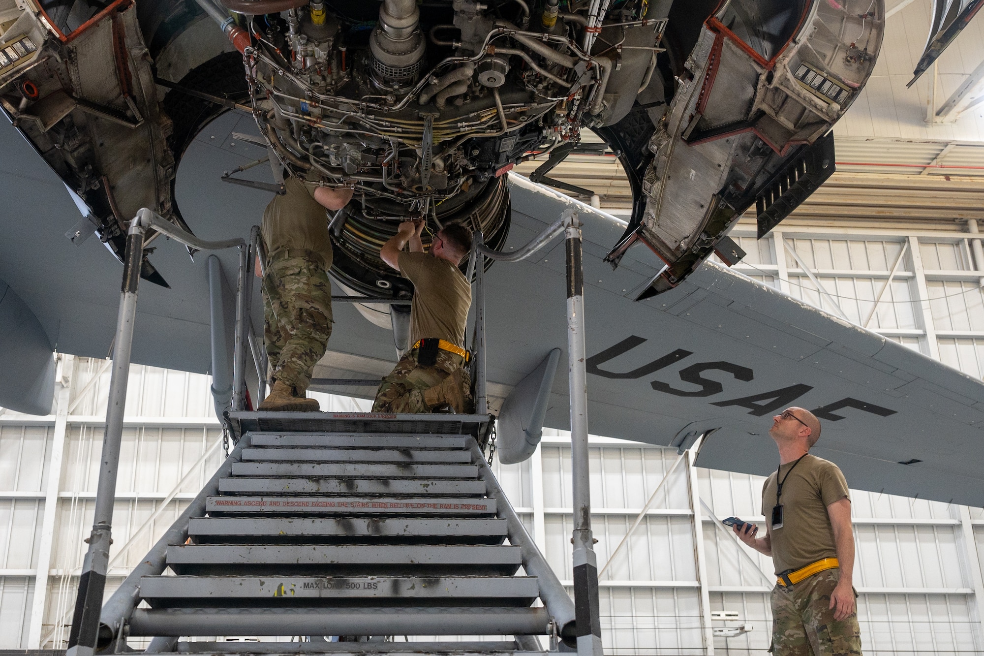 Air Force aircraft maintainers work on A C-17 Globemaster III Engine.