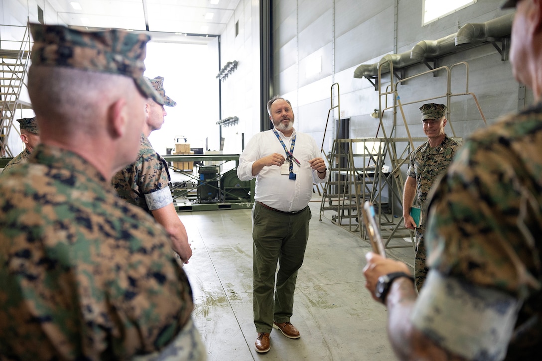 James Sauls, corrosion repair quality assurance specialist, Marine Corps Logistics Command, speaks with regional commanders and sergeants major Sept. 9, 2025, during the Marine Corps Installations East fall commander’s conference at Marine Corps Support Facility Blount Island in Jacksonville, Florida. He oversees processes that extend the service life of prepositioned equipment, ensuring Marines receive combat-ready gear worldwide. (U.S. Marine Corps photo by Dustin Senger)