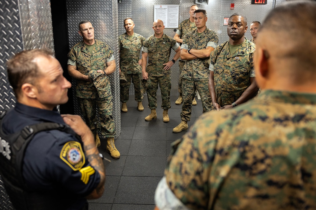 U.S. Marine Corps Brig. Gen. Ralph J. Rizzo Jr., commanding general of Marine Corps Installations East and Marine Corps Base Camp Lejeune, listens with regional commanders and sergeants major as Sgt. Maj. Julian Lumm, senior enlisted leader for Marine Corps Support Facility Blount Island, explains plans for a new indoor marksmanship range Sept. 9, 2025, during the Marine Corps Installations East fall commander’s conference at MCSF Blount Island in Jacksonville, Florida. The range will enhance training and readiness for those responsible for protecting the installation. (U.S. Marine Corps photo by Dustin Senger)