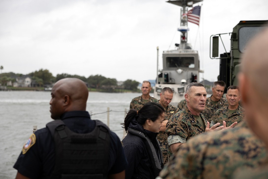 Regional commanders and sergeants major listen to U.S. Marine Corps Brig. Gen. Ralph J. Rizzo Jr., commanding general of Marine Corps Installations East and Marine Corps Base Camp Lejeune, discusses perimeter security while touring Blount Island aboard an Improved Navy Lighterage System Sept. 9, 2025, during the Marine Corps Installations East fall commander’s conference at Marine Corps Support Facility Blount Island in Jacksonville, Florida. (U.S. Marine Corps photo by Dustin Senger)