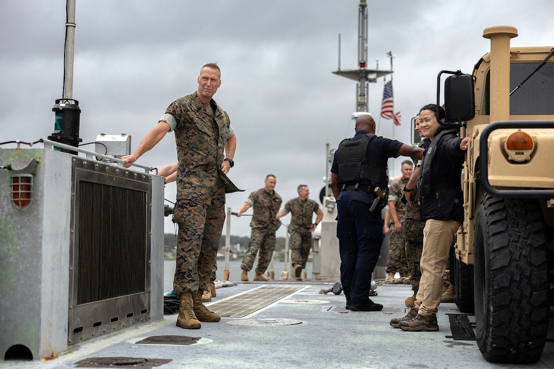 U.S. Marine Corps Sgt. Maj. Frank Kammer Jr., senior enlisted leader for Marine Corps Logistics Base Albany, braces as an Improved Navy Lighterage System returns to shore Sept. 9, 2025, during the Marine Corps Installations East fall commander’s conference at Marine Corps Support Facility Blount Island in Jacksonville, Florida. The ferry is a key component of ship-to-shore movement during maritime prepositioning force operations. (U.S. Marine Corps photo by Dustin Senger)