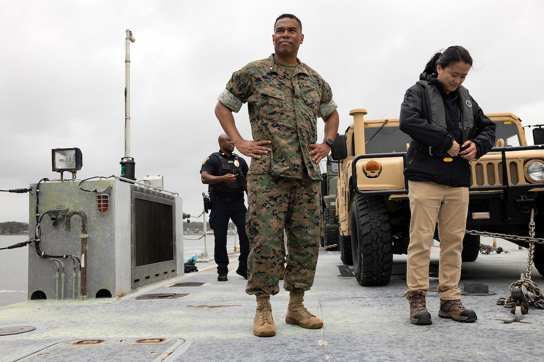 U.S. Marine Corps Col. David Merles, commanding officer of Marine Corps Support Facility Blount Island, returns from a perimeter tour aboard an Improved Navy Lighterage System Sept. 9, 2025, during the Marine Corps Installations East fall commander’s conference at MCSF Blount Island in Jacksonville, Florida. The ferry is a key component of ship-to-shore movement during maritime prepositioning force operations. (U.S. Marine Corps photo by Dustin Senger)