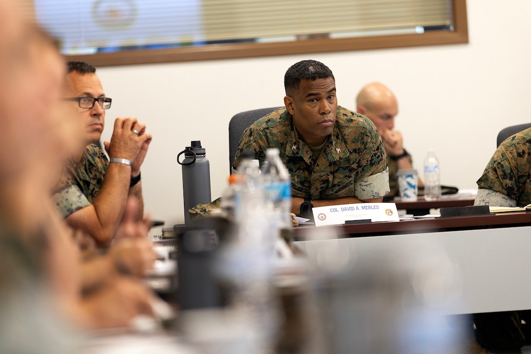 U.S. Marine Corps Col. David Merles, commanding officer of Marine Corps Support Facility Blount Island, listens to regional commanders and sergeants major Sept. 9, 2025, during the Marine Corps Installations East fall commander’s conference in Jacksonville, Florida. The conference brought leaders together to align regional priorities and highlight Blount Island’s role in sustaining global Marine Corps operations. (U.S. Marine Corps photo by Dustin Senger)