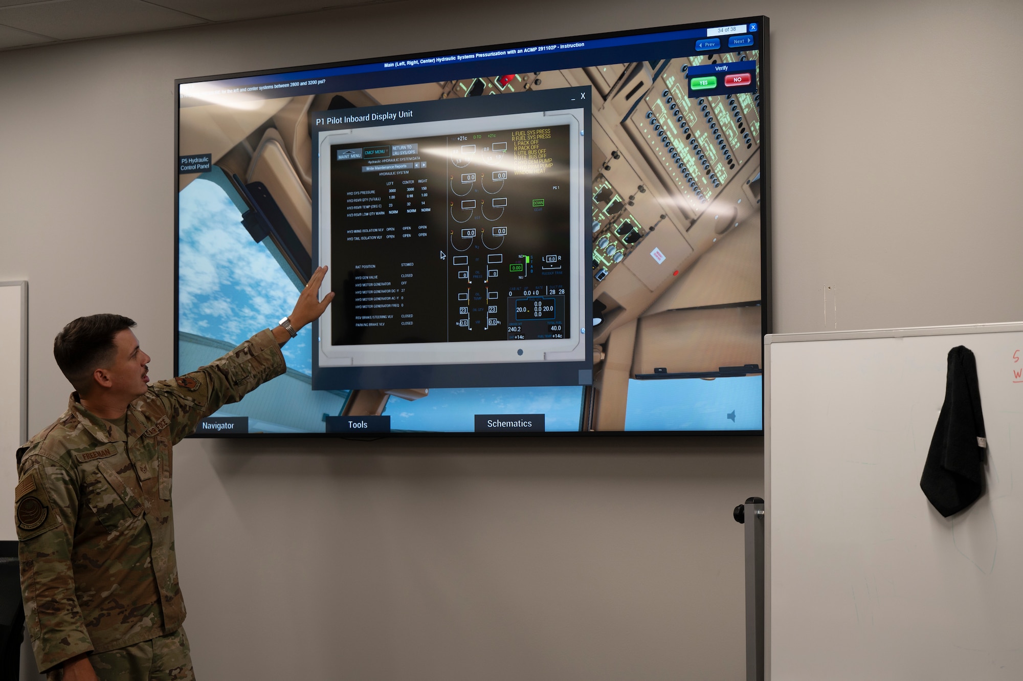 U.S. Air Force Staff Sgt. Thomas Freeman, 373rd Training Squadron Detachment 1 KC-46A Pegasus Mission Ready Airmen instructor, walks students through a technical order on the virtual maintenance training system at Joint Base McGuire-Dix-Lakehurst, N.J., Aug. 27, 2025. VMTS is a 3D, fully interactive system that can be used to provide guided or unguided instruction.