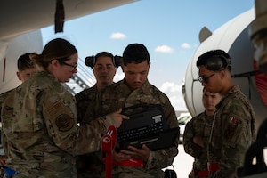 U.S. Air Force Tech. Sgt. Melissa Davis, 373rd Training Squadron Detachment 1 KC-46A Pegasus Mission Ready Airmen instructor, reviews warnings and cautions prior to conducting hands-on training at Joint Base McGuire-Dix-Lakehurst, N.J., Sept. 3, 2025. Students practiced each step and received guidance and feedback during each training lesson.