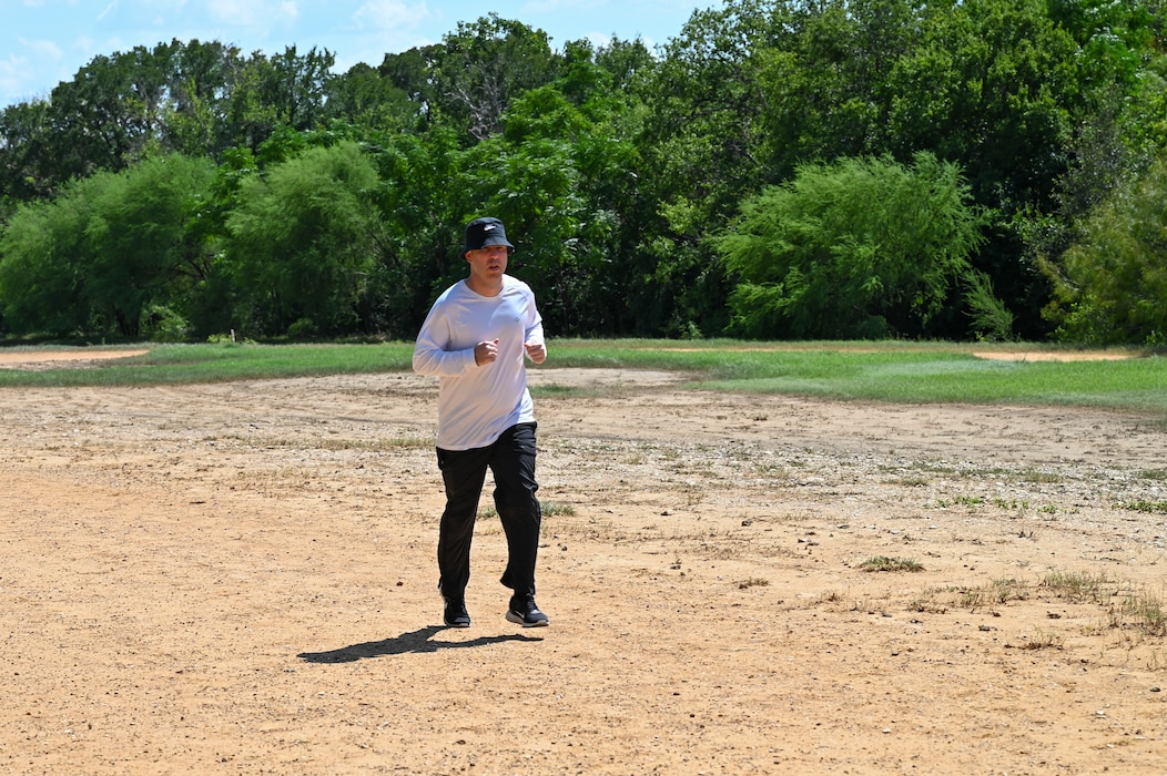 Col. Joshua Garrison, 960th Cyberspace Wing commander, participates in a 40,000-mile challenge during a run at the Medina Chapman Fitness Center on Joint Base San Antonio-Lackland, Texas, Sept. 2, 2025.