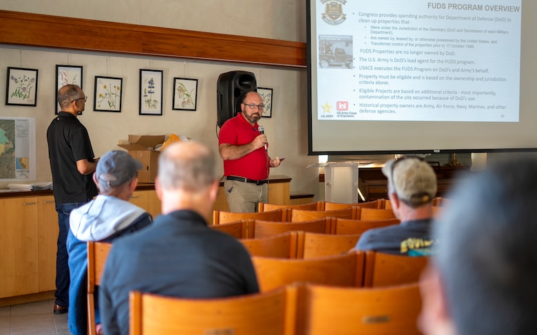 Daniel Huff, U.S. Army Corps of Engineers project manager, center, helps San Luis Obispo community members better understand the regulatory process and environmental cleanup being conducted in their community during a public meeting Aug. 25 at the San Luis Obispo Botanical Garden, California.