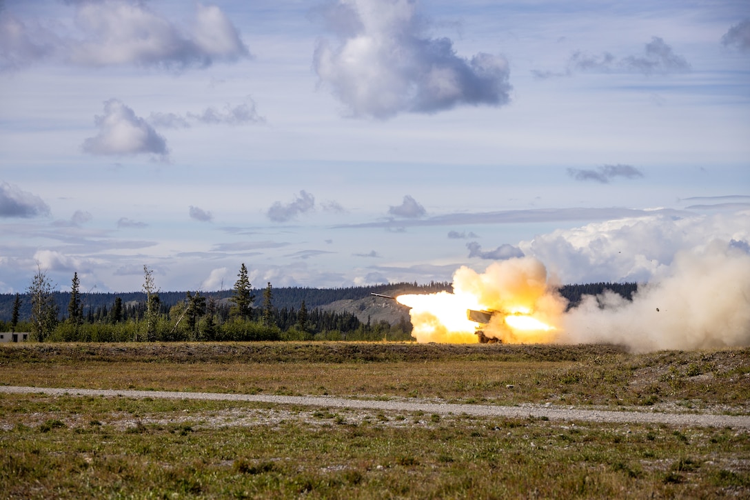 Marines with 2nd Battalion, 14th Marine regiment, 4th Marine Division, fire a High Mobility Artillery Rocket System during ARCTIC EDGE 2025 (AE25) at Donnely Training Area, Alaska, Aug. 22, 2025. Specialized Arctic training generates valuable lessons learned for warfighters and enablers ensuring they can execute their assigned missions in any environment. AE25 is a NORAD and U.S. Northern Command-led homeland defense exercise designed to improve readiness, demonstrate capabilities and enhance Joint and Allied Force interoperability in the Arctic. (U.S. Marine Corps Photo by Lance Cpl. Edward Spears.)