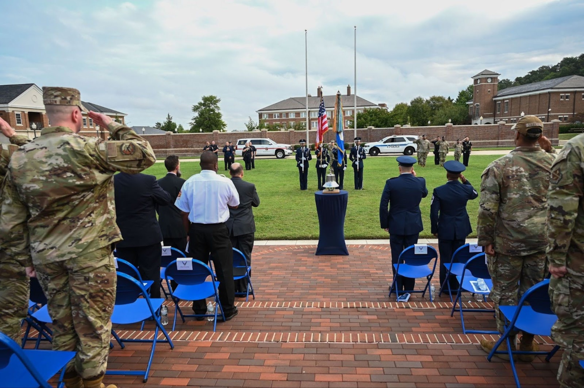 Members of the 11th Wing salute for the presentation of the colors and singing of the national anthem during a 9/11 remembrance ceremony at Joint Base Anacostia-Bolling, Washington, D.C., Sep. 11, 2025.