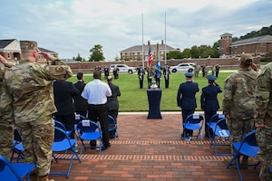 Members of the 11th Wing salute for the presentation of the colors and singing of the national anthem during a 9/11 remembrance ceremony at Joint Base Anacostia-Bolling, Washington, D.C., Sep. 11, 2025.