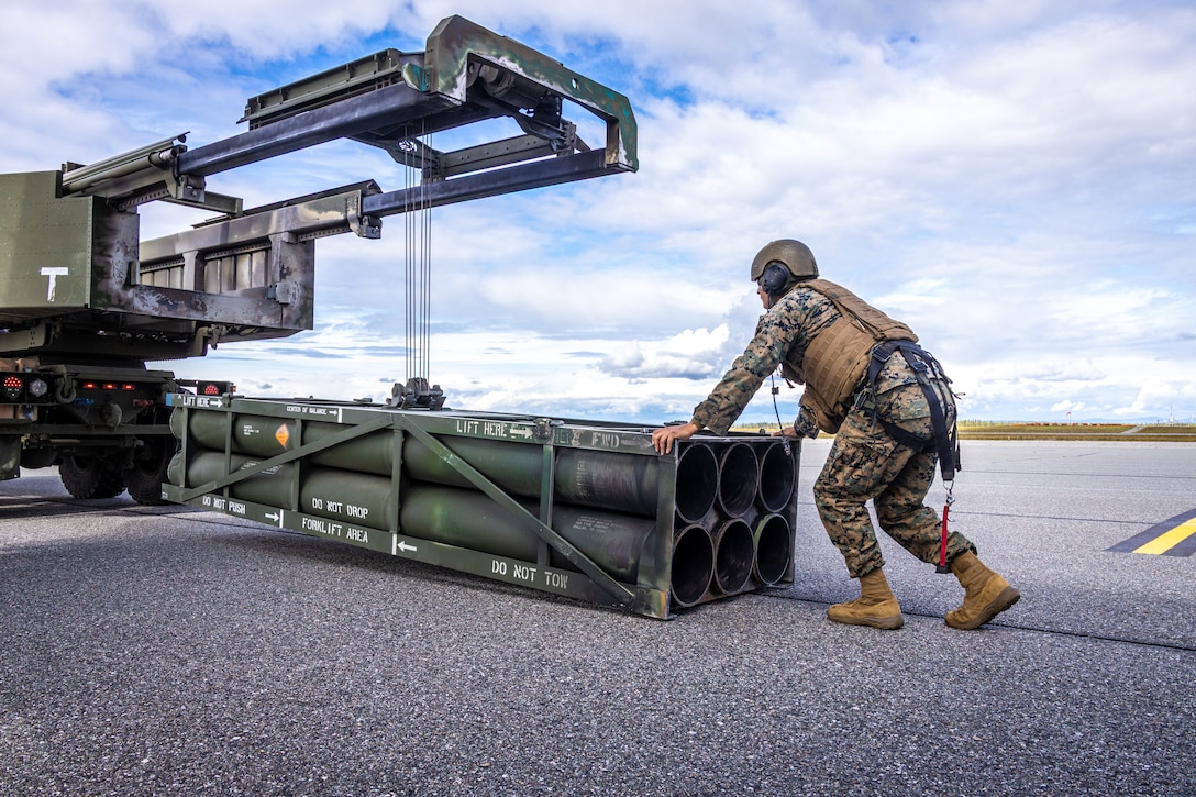 U.S. Marines Sgt. Julio Torres, High Mobility Artillery Rocket System (HIMARS) launcher chief, with 2nd Battalion, 14th Marine regiment, 4th Marine Division, detach a used rocket casing during ARCTIC EDGE 2025 (AE25) at Fort Greenly, Alaska, Aug. 22, 2025. Specialized Arctic training generates valuable lessons learned for warfighters and enablers ensuring they can execute their assigned missions in any environment. AE25 is a NORAD and U.S. Northern Command-led homeland defense exercise designed to improve readiness, demonstrate capabilities and enhance Joint and Allied Force interoperability in the Arctic. (U.S. Marine Corps Photo by Lance Cpl. Edward Spears.)