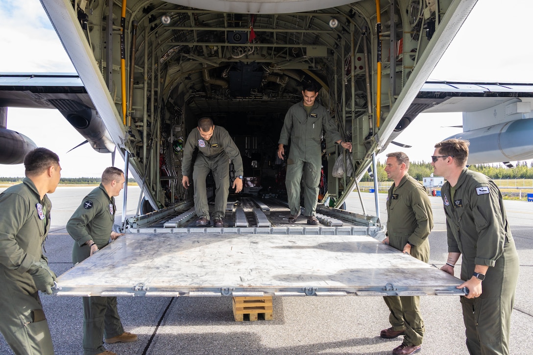 Marines with Marine Aerial Refueler Squadron 234 (VMGR-234), 4th Marine Aircraft Wing, prepare a KC-130J Hercules multi-role, medium sized fixed wing tactical aircraft for cargo during ARCTIC EDGE 2025 (AE25) at Fort Greenly, Alaska, Aug. 22, 2025. Specialized Arctic training generates valuable lessons learned for warfighters and enablers ensuring they can execute their assigned missions in any environment. AE25 is a NORAD and U.S. Northern Command-led homeland defense exercise designed to improve readiness, demonstrate capabilities and enhance Joint and Allied Force interoperability in the Arctic. (U.S. Marine Corps Photo by Lance Cpl. Edward Spears.)