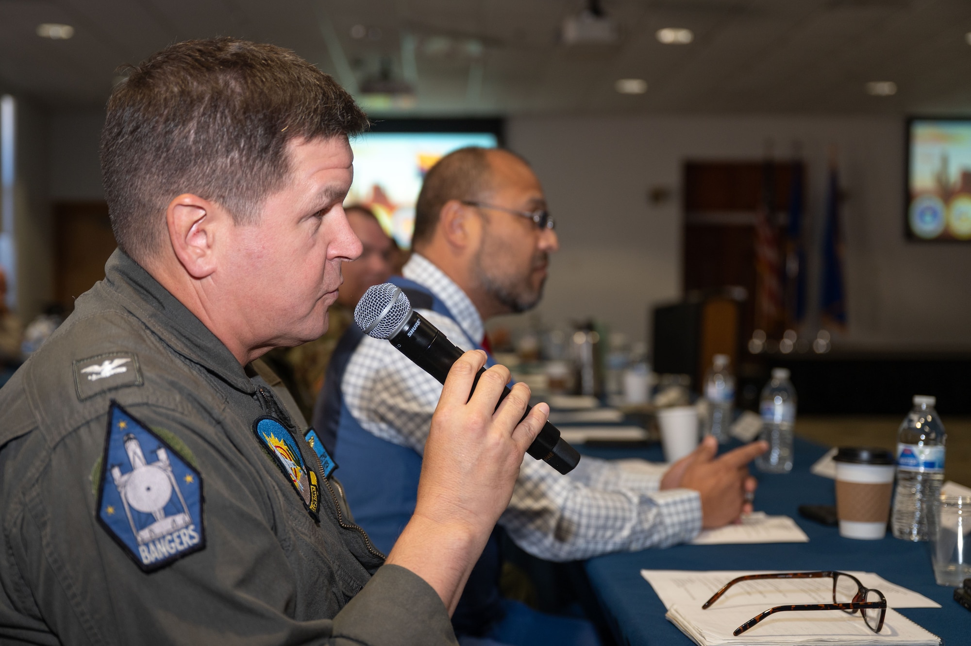 U.S. Navy Capt. Ryan “Mouth” Carstens, Naval Air Facility El Centro commanding officer, speaks during the Arizona Commanders Summit at Davis-Monthan Air Force Base, Arizona, September 9, 2025. Carstens provided an overview of NAF El Centro’s mission to summit attendees. (U.S. Air Force photo by Airman Jaden Kidd)