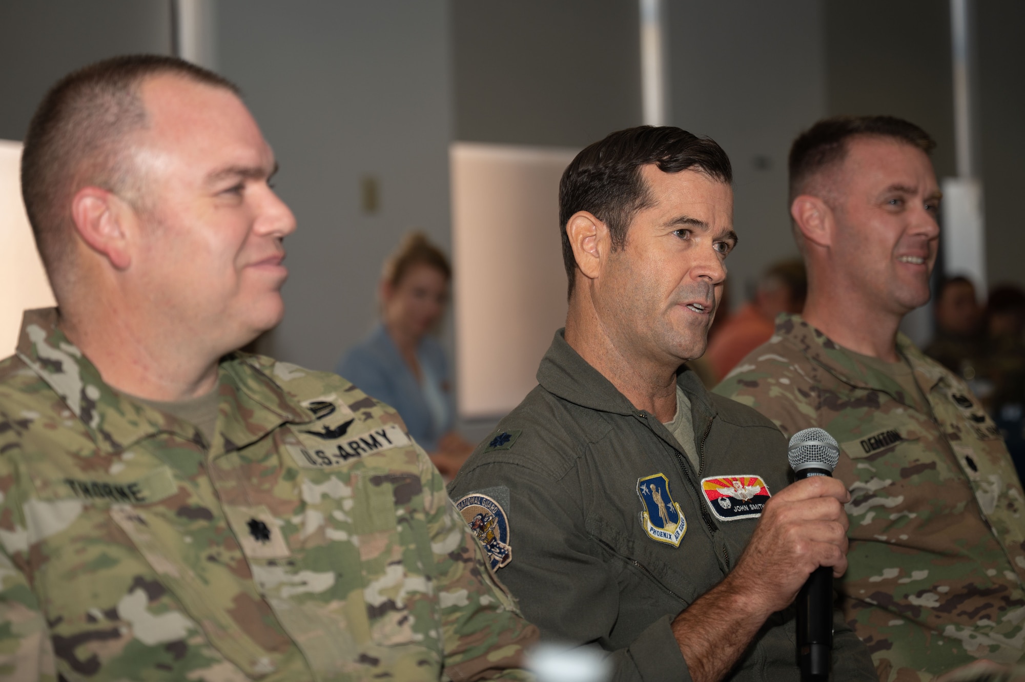 U.S. Air Force Lt. Col. John Smith, 161st Air Refueling Wing deputy commander, speaks during the Arizona Commanders Summit at Davis-Monthan Air Force Base, Arizona, September 9, 2025. Smith provided an overview of the state of the 161st Air Refueling Wing to summit attendees. (U.S. Air Force photo by Airman Jaden Kidd)