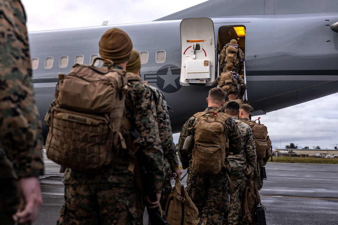 U.S. Marines load onto a C-40A aircraft, assigned to Marine Transport Squadron (VMR) 1, Marine Air Group 41, 4th Marine Air Wing, during ARCTIC EDGE 2025 (AE25) at Joint Base Elmendorf-Richardson, Alaska, Aug. 21, 2025. Specialized Arctic training generates valuable lessons learned for warfighters and enablers ensuring they can execute their assigned missions in any environment. AE25 is a NORAD and U.S. Northern Command-led homeland defense exercise designed to improve readiness, demonstrate capabilities and enhance Joint and Allied Force interoperability in the Arctic. (U.S. Marine Corps Photo by Lance Cpl. Edward Spears)